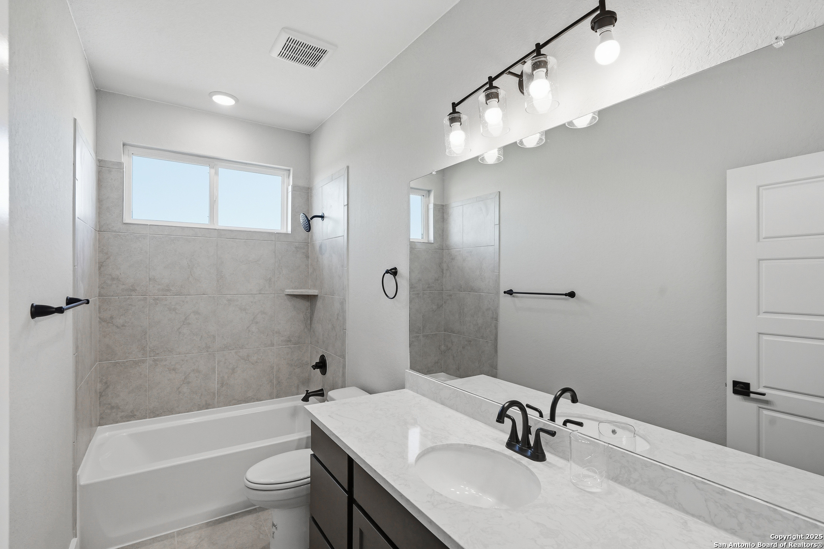 326 Vamanos Boerne, TX 78006 - Photo 40 of 55 a bathroom with a sink a toilet and shower