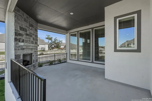 a view of a swimming pool with a patio