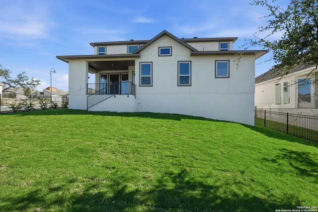 an aerial view of a pool yard swimming pool and outdoor seating