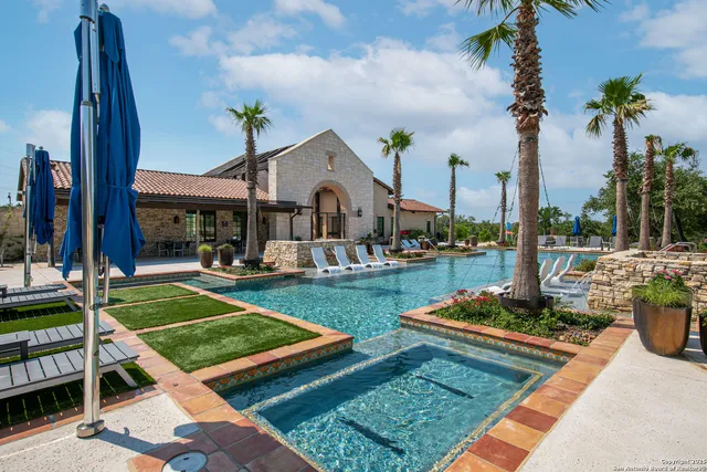 a view of a swimming pool with a yard