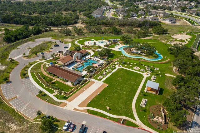 swimming pool view with a garden space