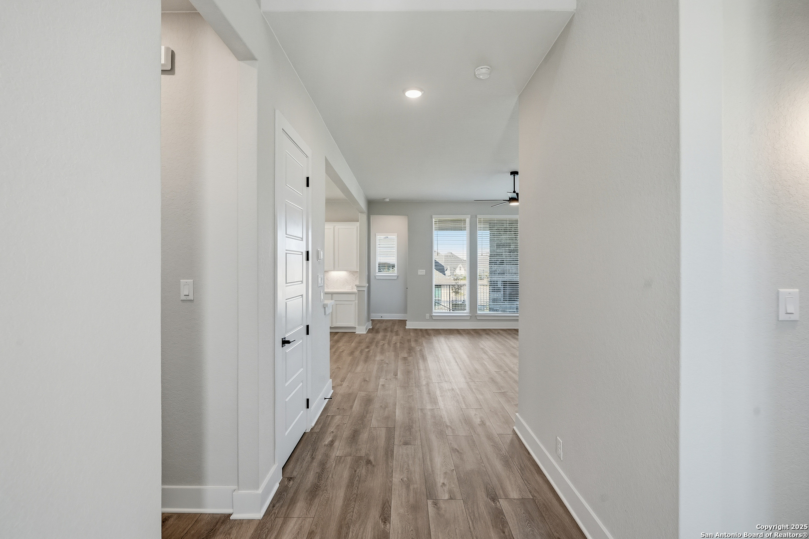 326 Vamanos Boerne, TX 78006 - Photo 6 of 55 wooden floor in an empty room with a window
