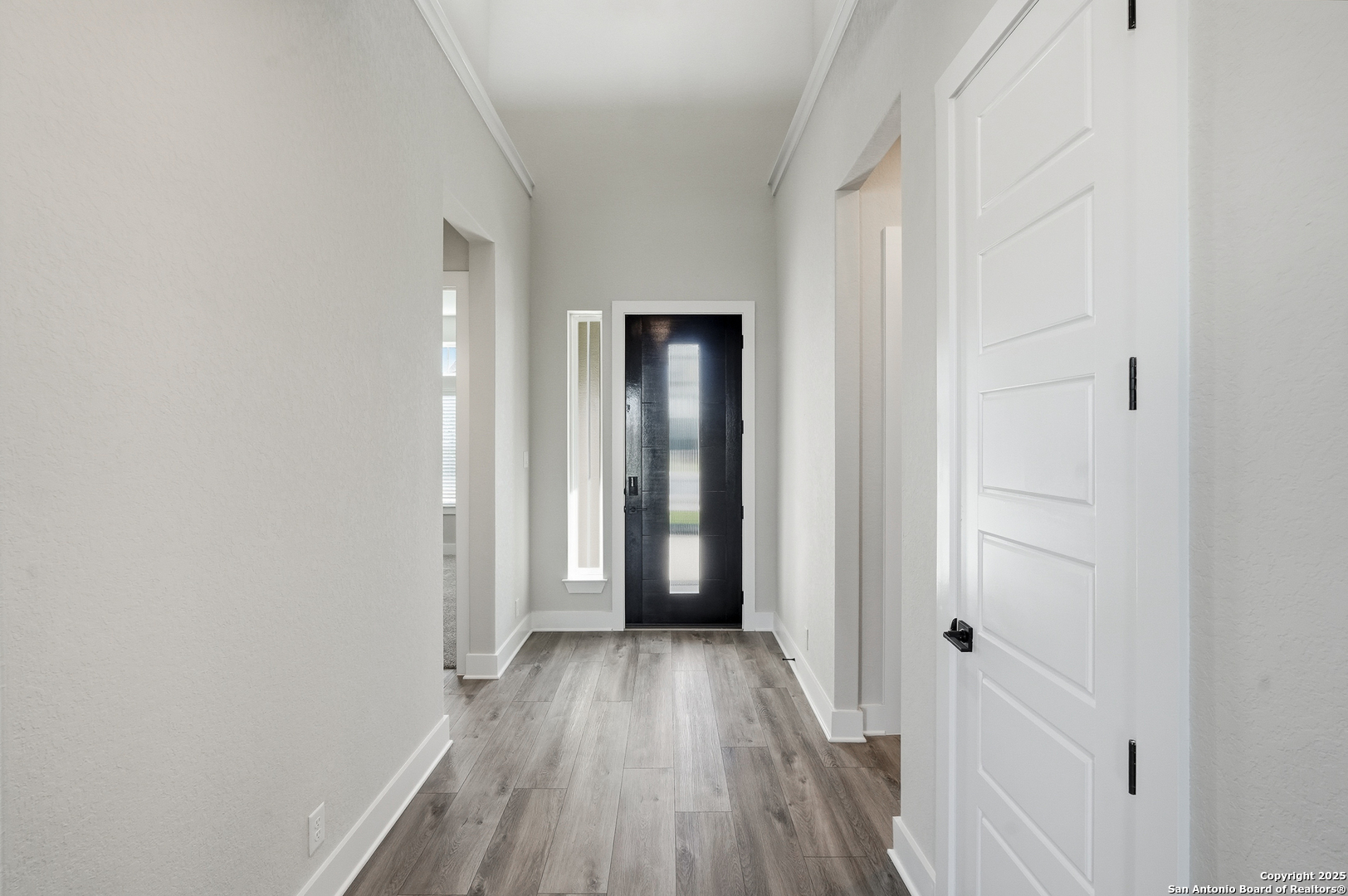 326 Vamanos Boerne, TX 78006 - Photo 10 of 55 a view of a hallway with wooden floor