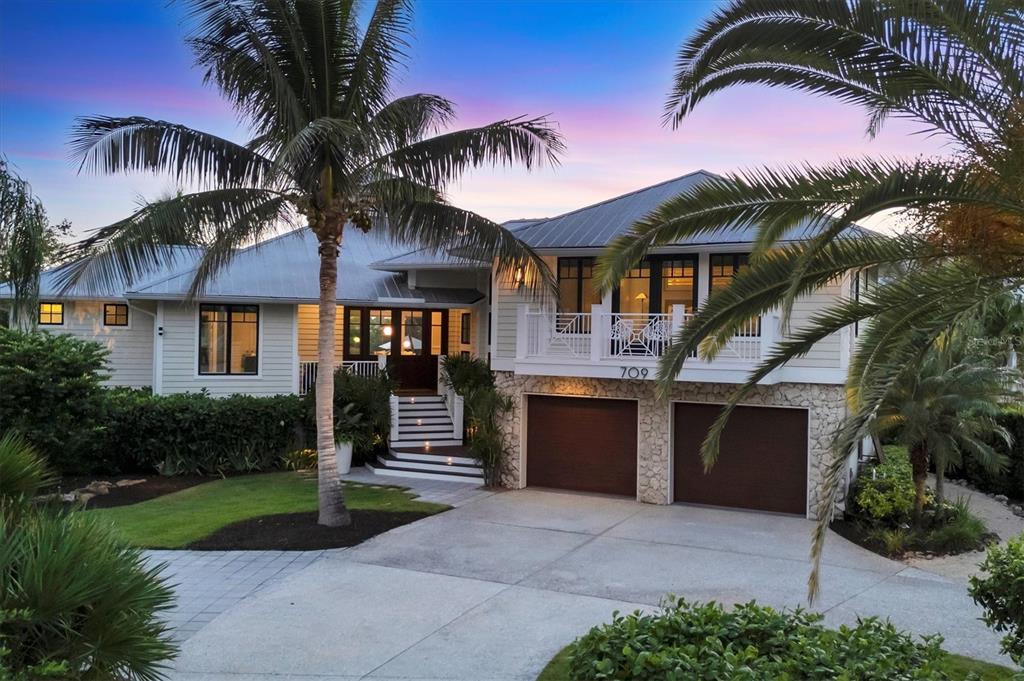 709 Eagle Point Drive Venice, FL 34285 - Photo 1 of 1 a front view of a house with a yard and garage
