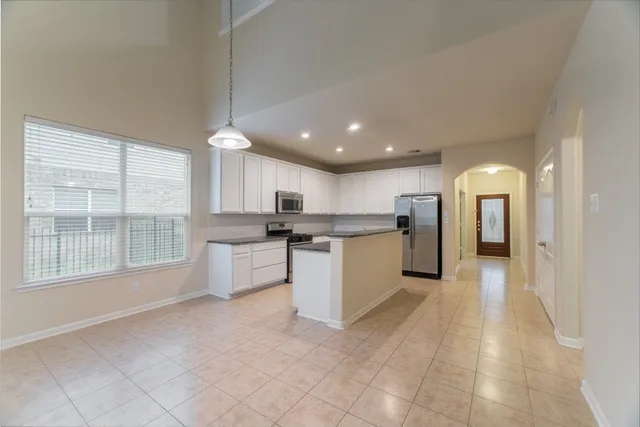 a view of kitchen with furniture and window