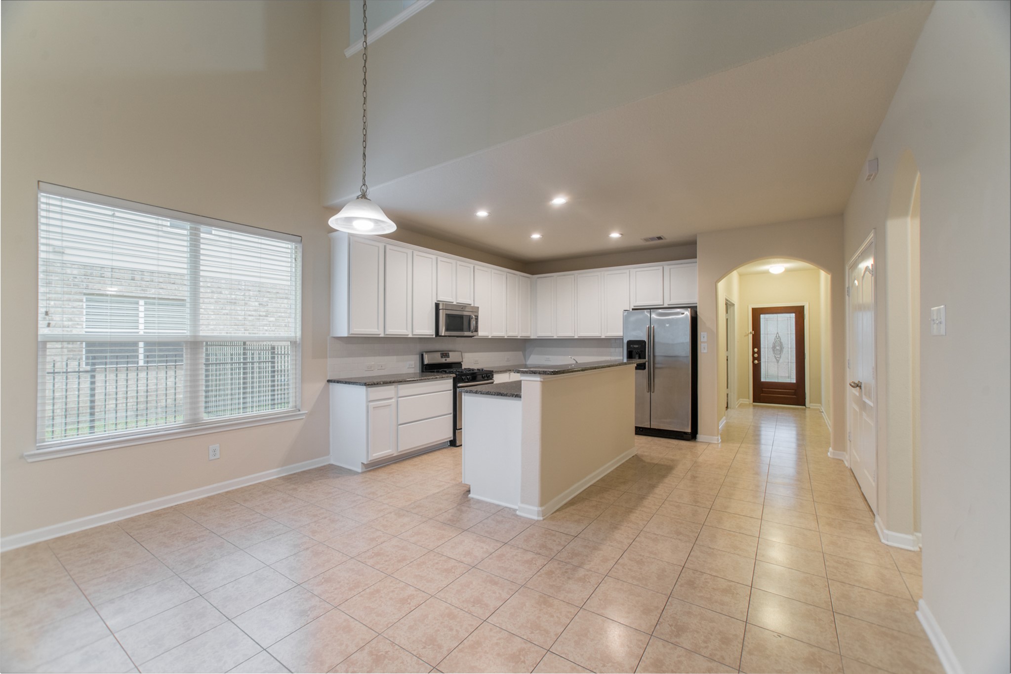 78 East Heritage Mill Circle The Woodlands, TX 77375 - Photo 20 of 50 a view of a kitchen with a sink and cabinets