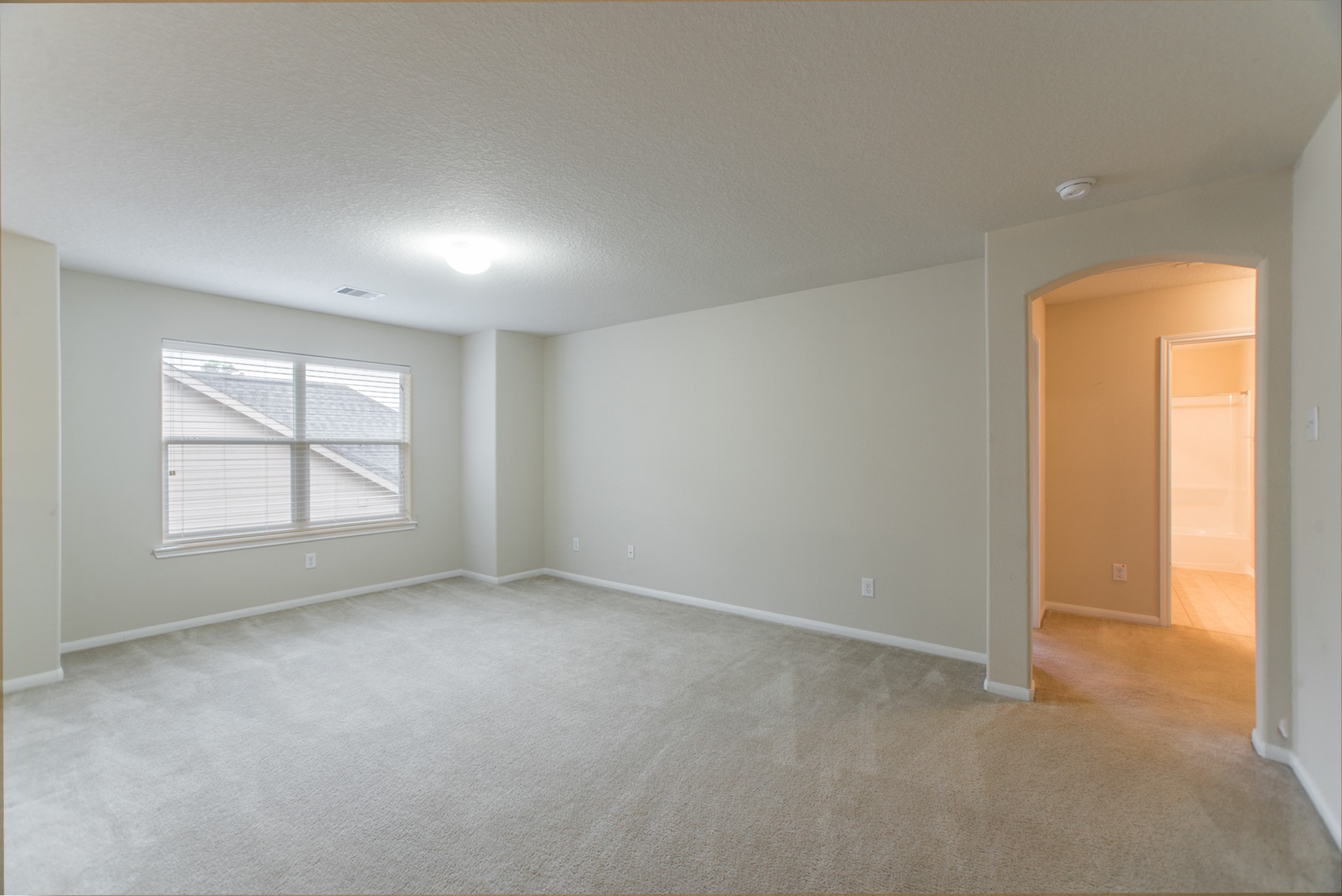 78 East Heritage Mill Circle The Woodlands, TX 77375 - Photo 32 of 50 an empty room with a empty space and windows