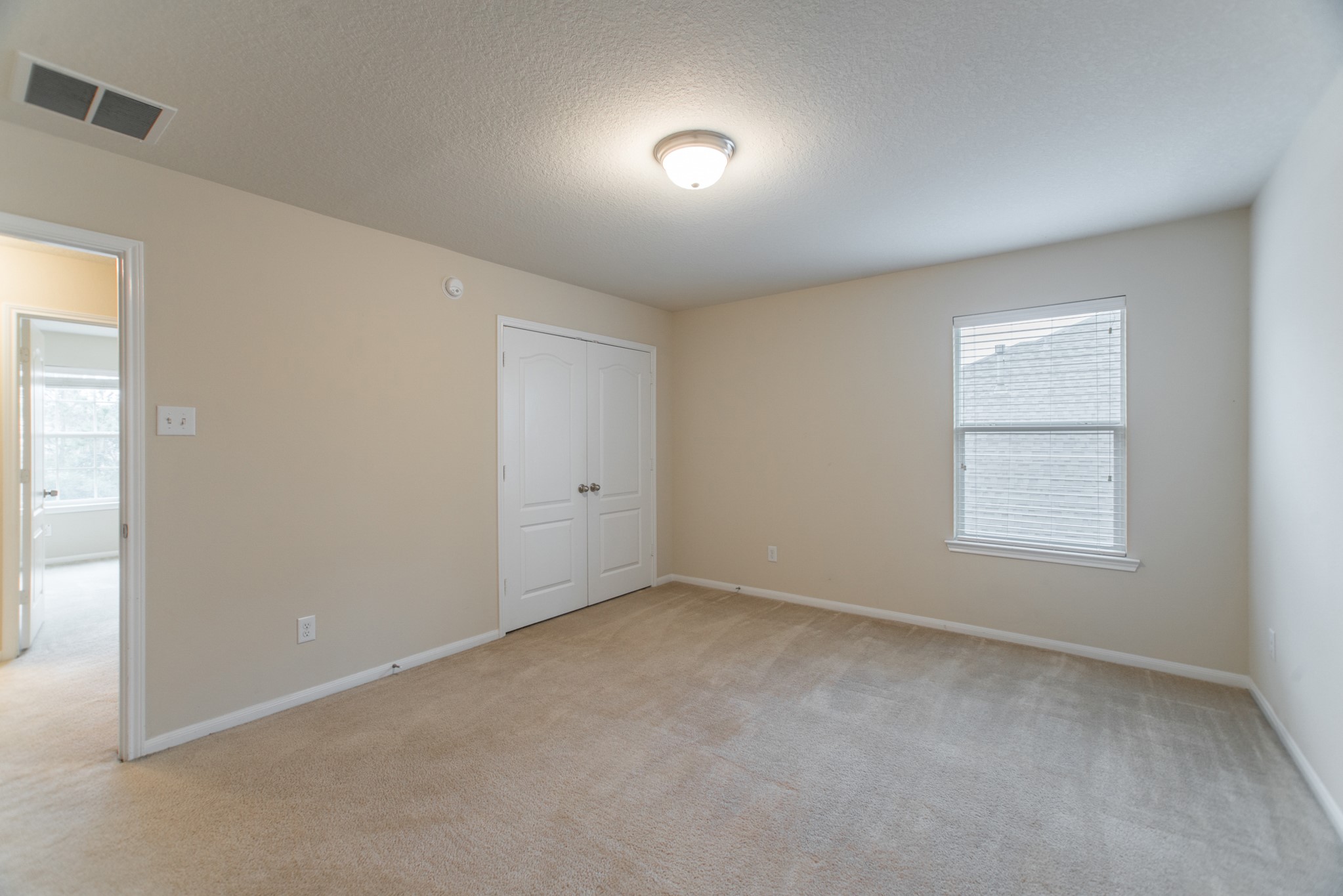78 East Heritage Mill Circle The Woodlands, TX 77375 - Photo 36 of 50 an empty room with a window