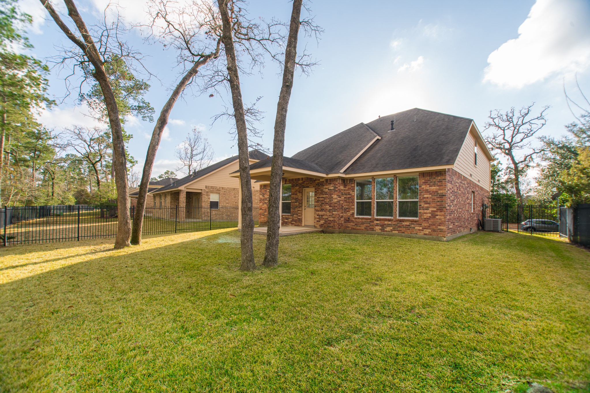 78 East Heritage Mill Circle The Woodlands, TX 77375 - Photo 41 of 50 a front view of a house with a yard