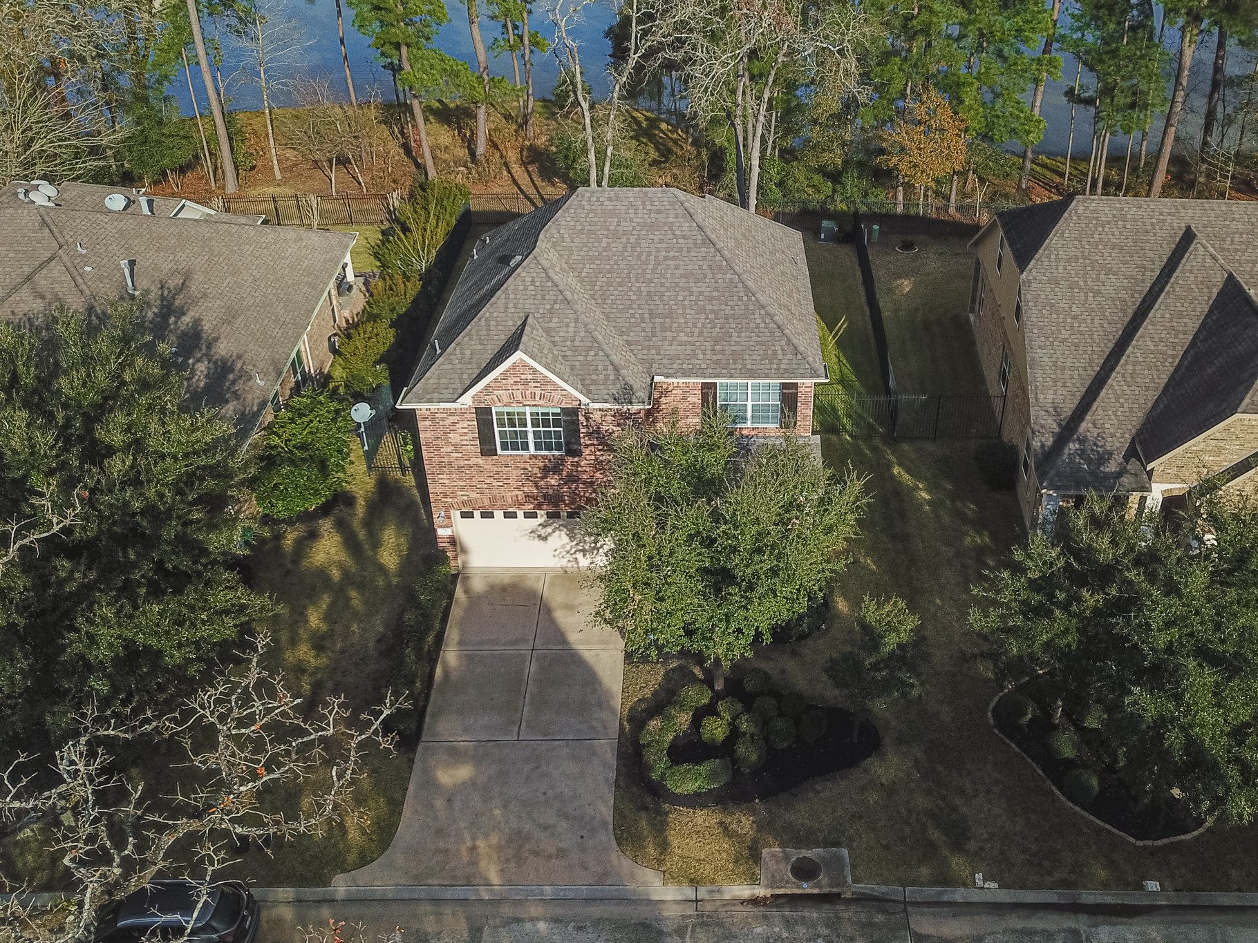 78 East Heritage Mill Circle The Woodlands, TX 77375 - Photo 49 of 50 a view of a house with a yard