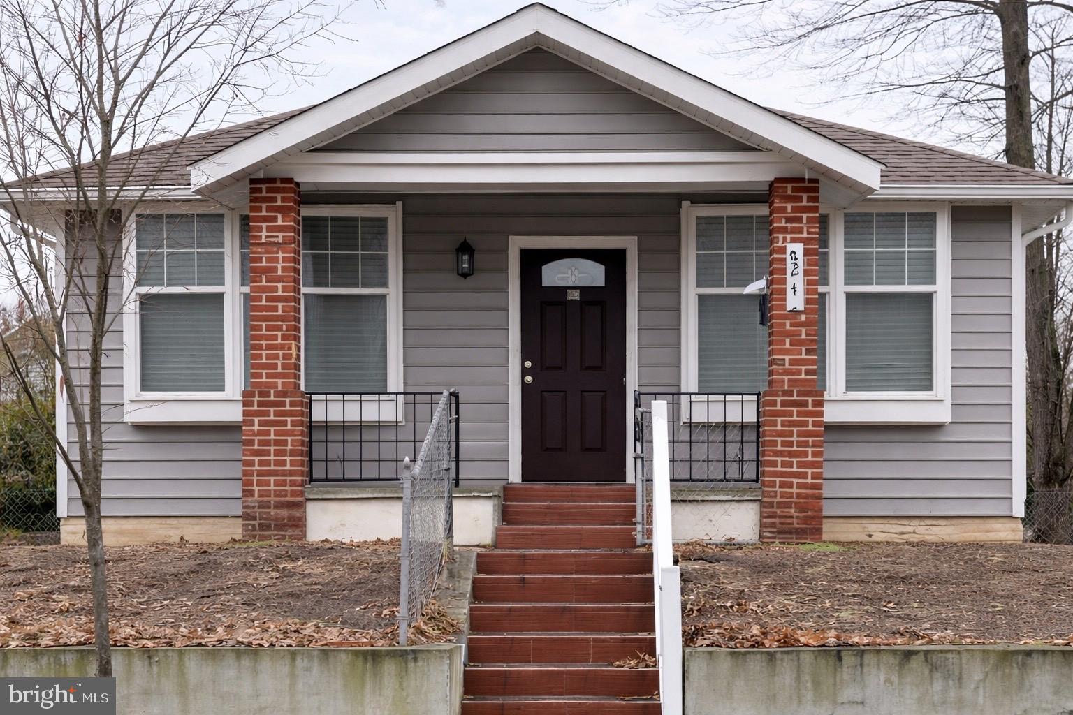 4243 Dix Street Northeast Washington, DC 20019 - Photo 1 of 43 a front view of a house with stairs