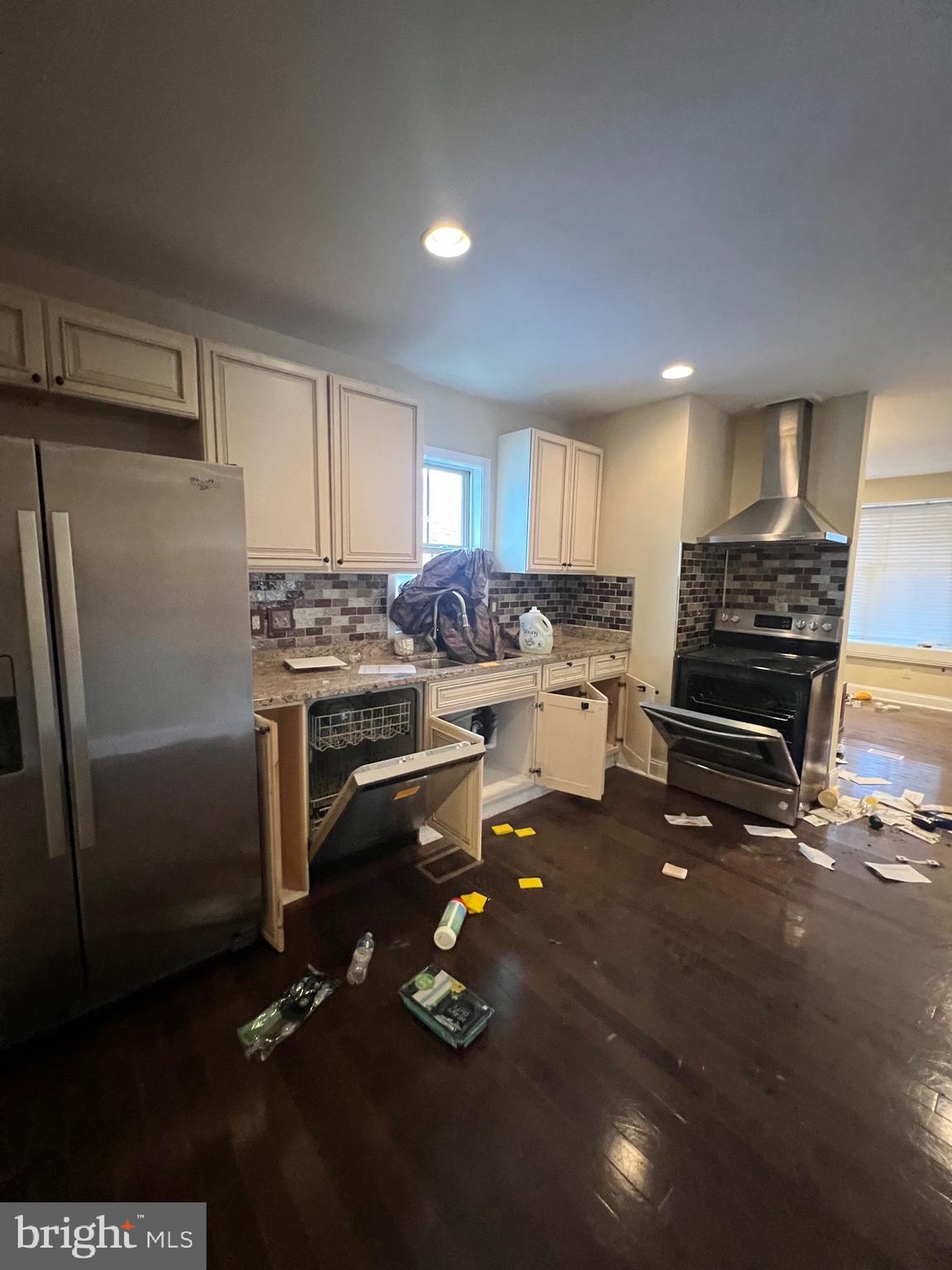 4243 Dix Street Northeast Washington, DC 20019 - Photo 12 of 43 a kitchen with a refrigerator and a stove top oven