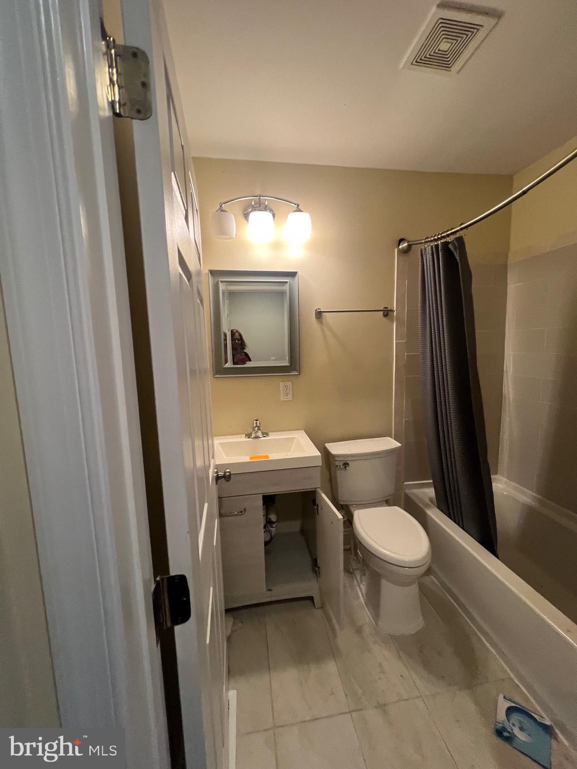 4243 Dix Street Northeast Washington, DC 20019 - Photo 13 of 43 a bathroom with a sink toilet and shower