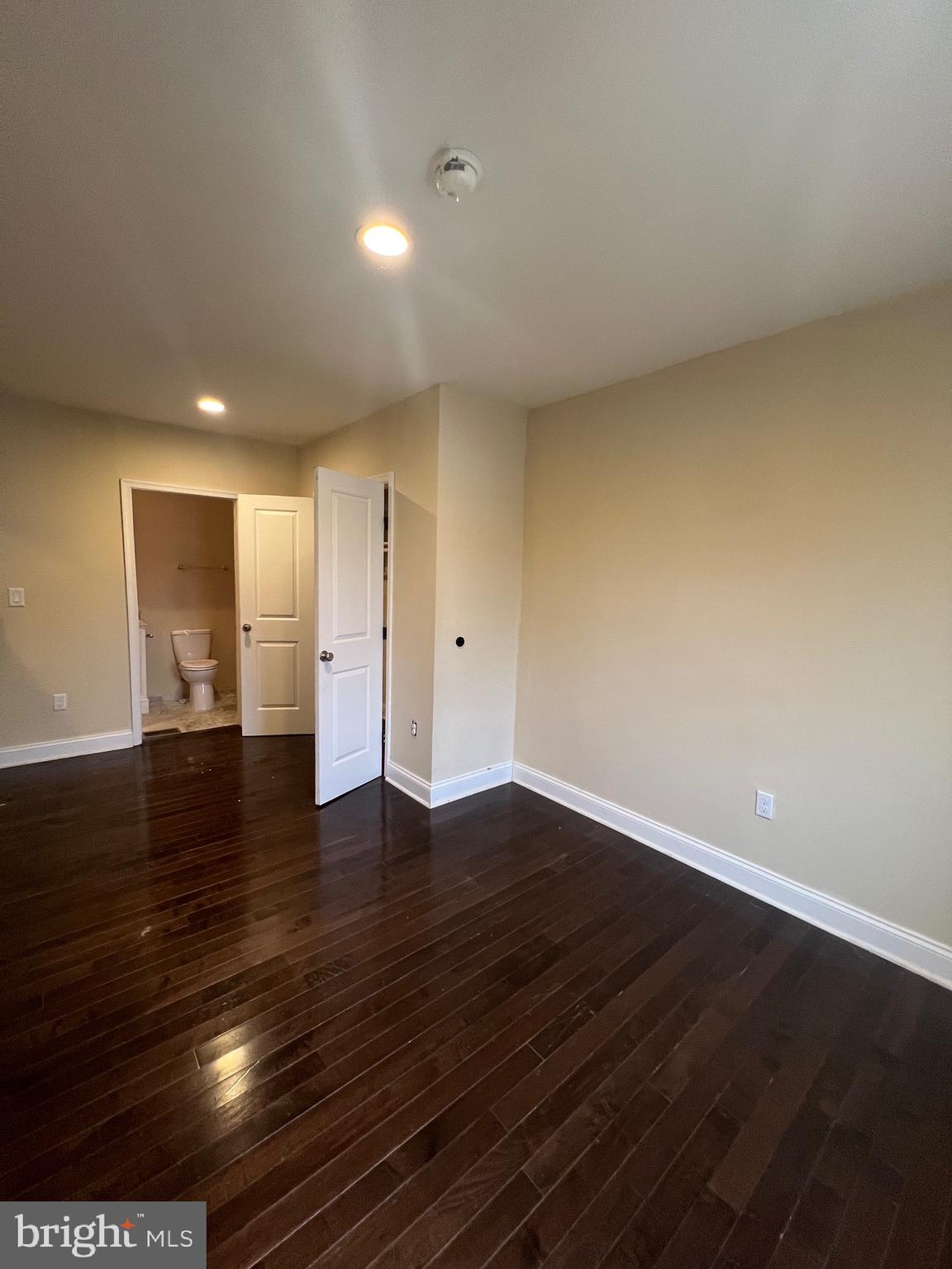4243 Dix Street Northeast Washington, DC 20019 - Photo 15 of 43 a view of an empty room with wooden floor