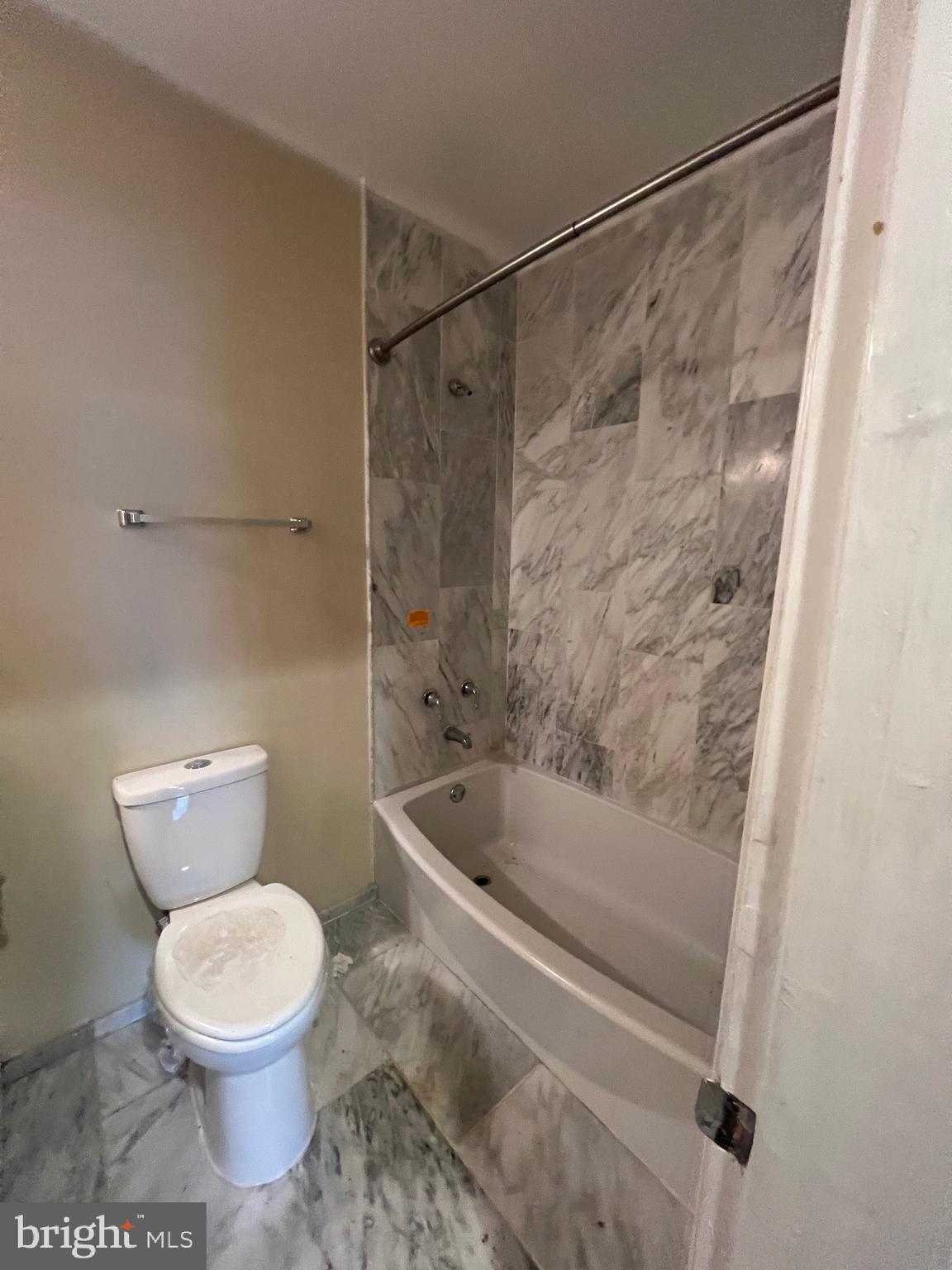 4243 Dix Street Northeast Washington, DC 20019 - Photo 18 of 43 a bathroom with a toilet and a shower