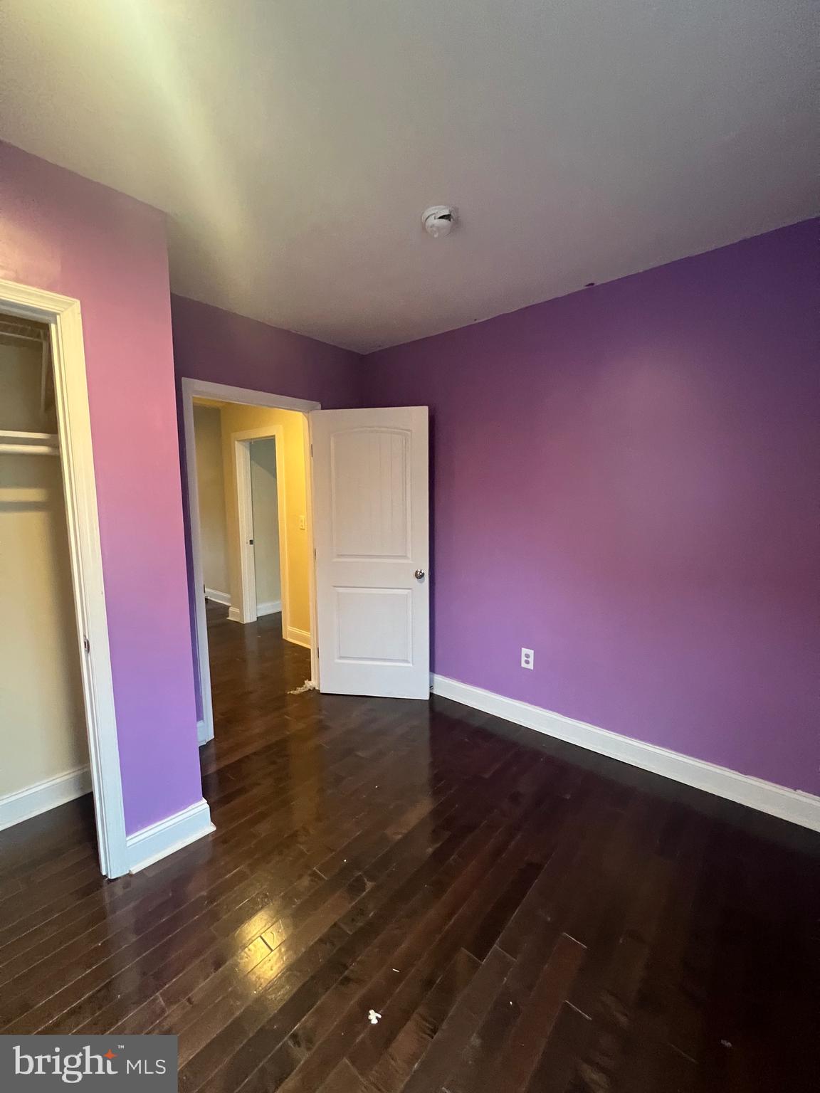 4243 Dix Street Northeast Washington, DC 20019 - Photo 20 of 43 a view of an empty room with wooden floor and a window