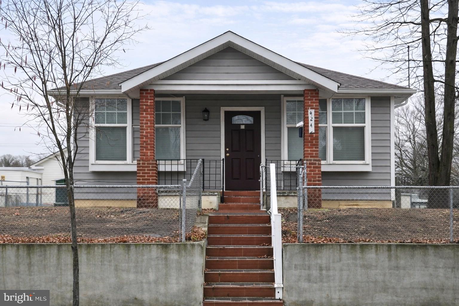 4243 Dix Street Northeast Washington, DC 20019 - Photo 2 of 43 a front view of a house with entrance door