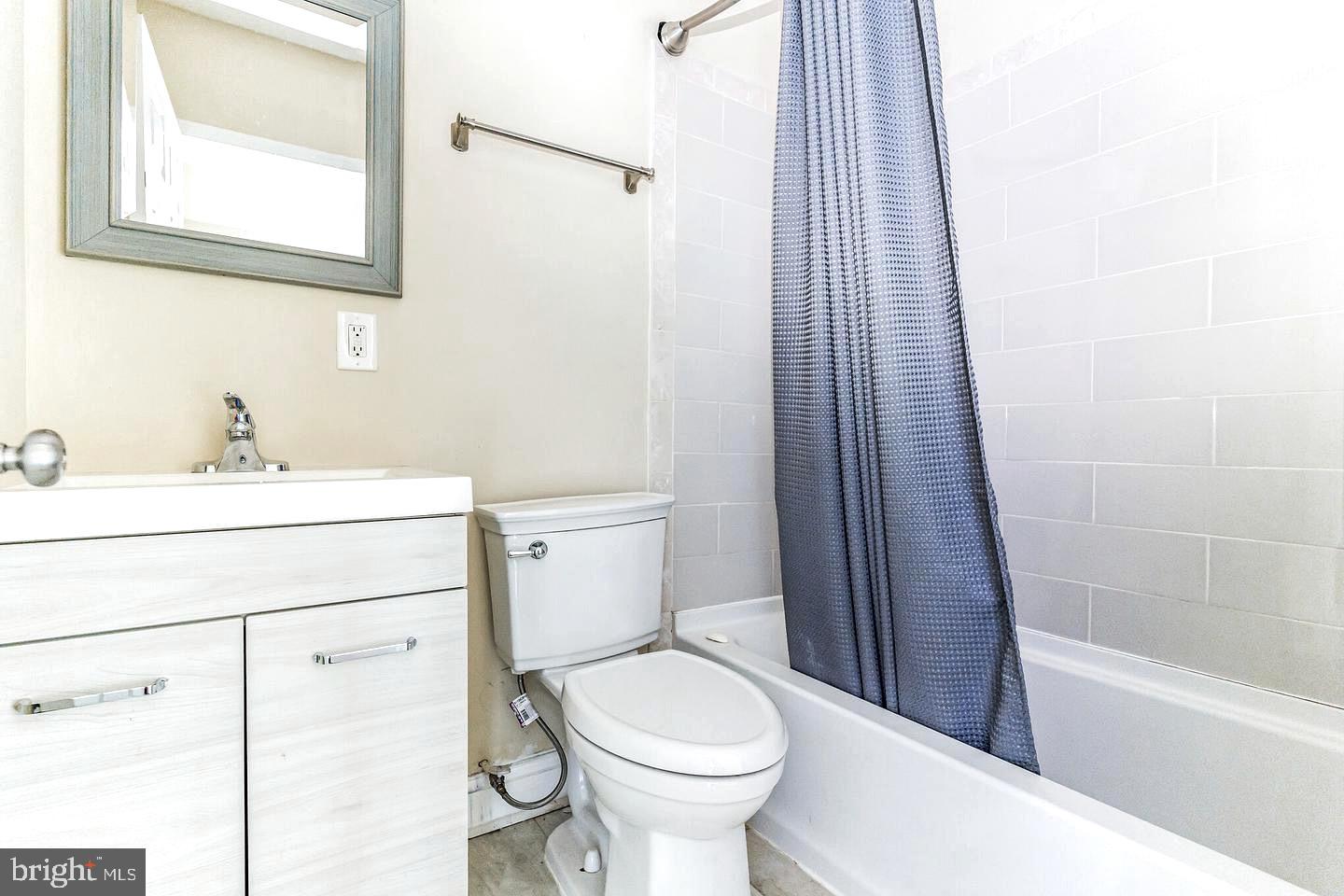 4243 Dix Street Northeast Washington, DC 20019 - Photo 22 of 43 a bathroom with a sink toilet and shower