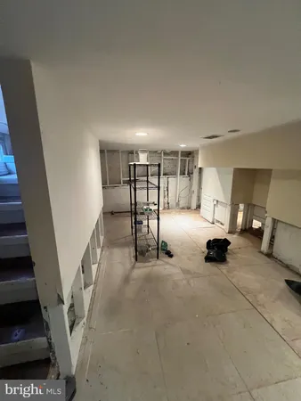 a big room with lots of table and a couch
