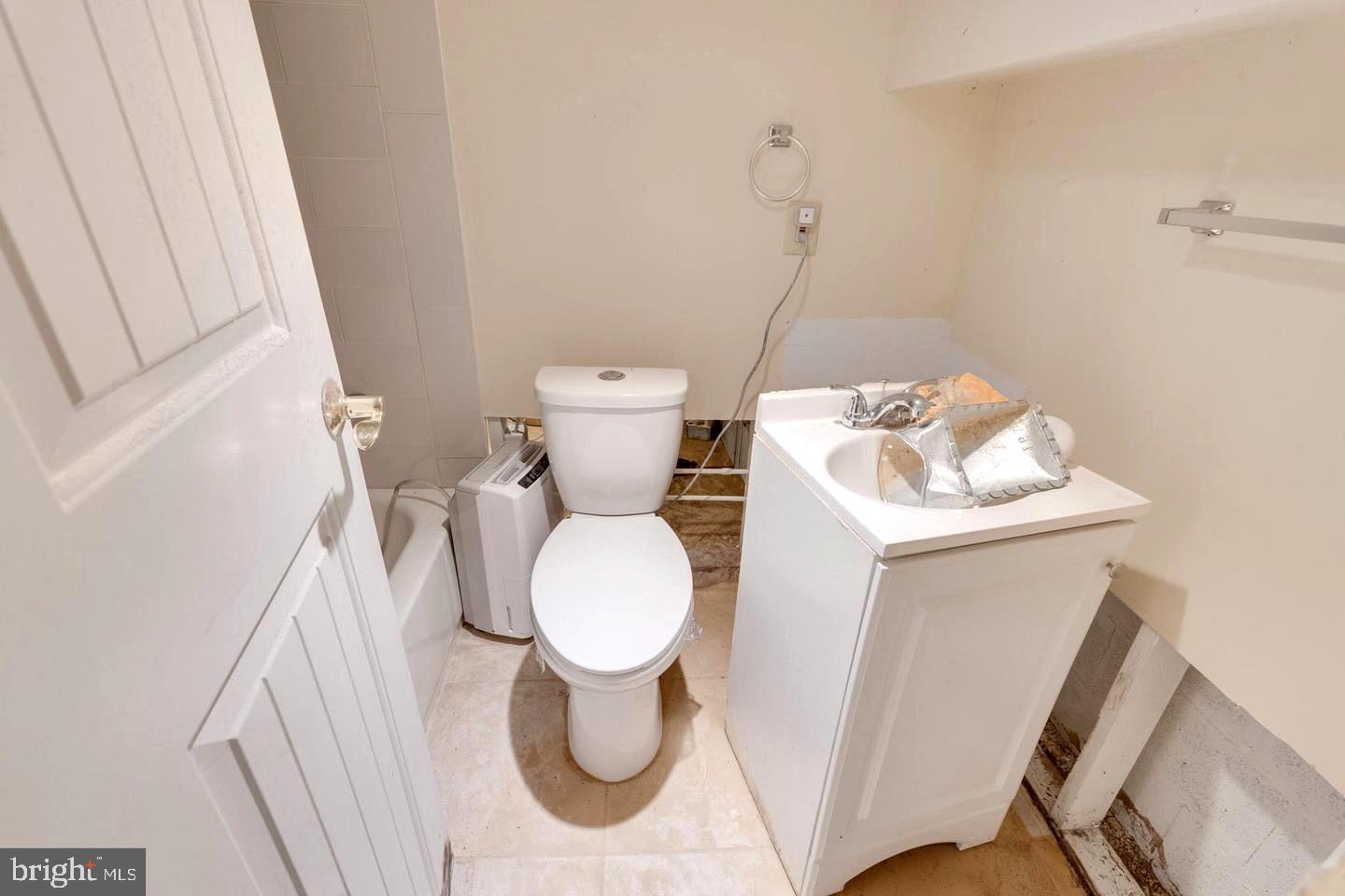 4243 Dix Street Northeast Washington, DC 20019 - Photo 29 of 43 a bathroom with a sink and toilet