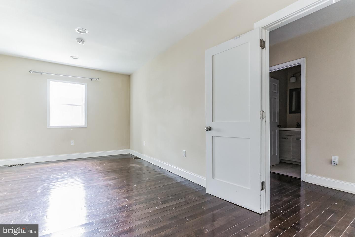 4243 Dix Street Northeast Washington, DC 20019 - Photo 36 of 43 an empty room with wooden floor & windows