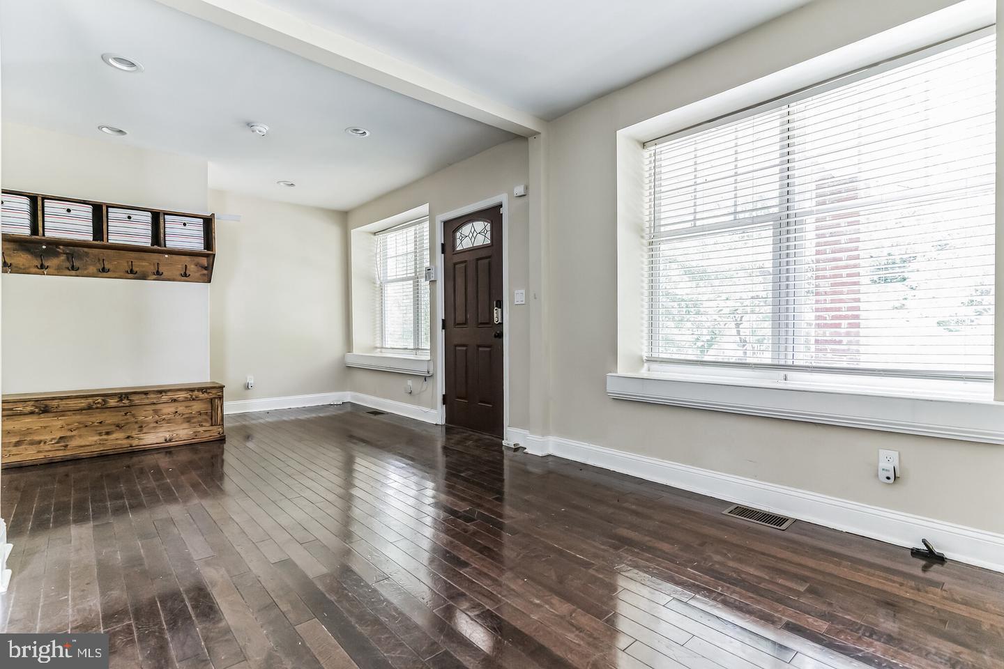 4243 Dix Street Northeast Washington, DC 20019 - Photo 40 of 43 a view of an empty room with wooden floor and a window