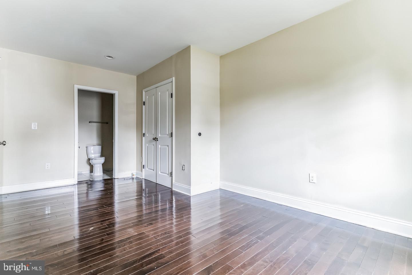 4243 Dix Street Northeast Washington, DC 20019 - Photo 42 of 43 a view of an empty room with wooden floor