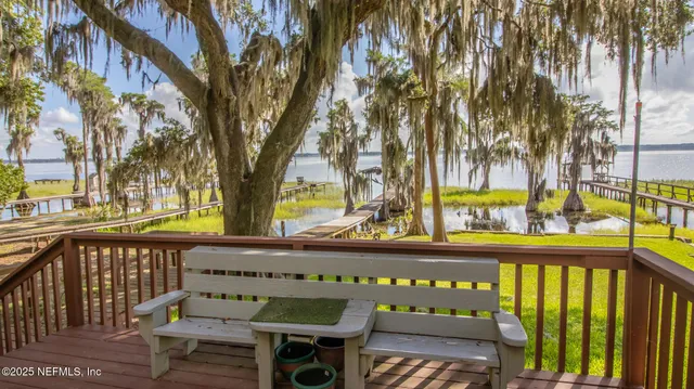 a city view from a balcony with outdoor seating