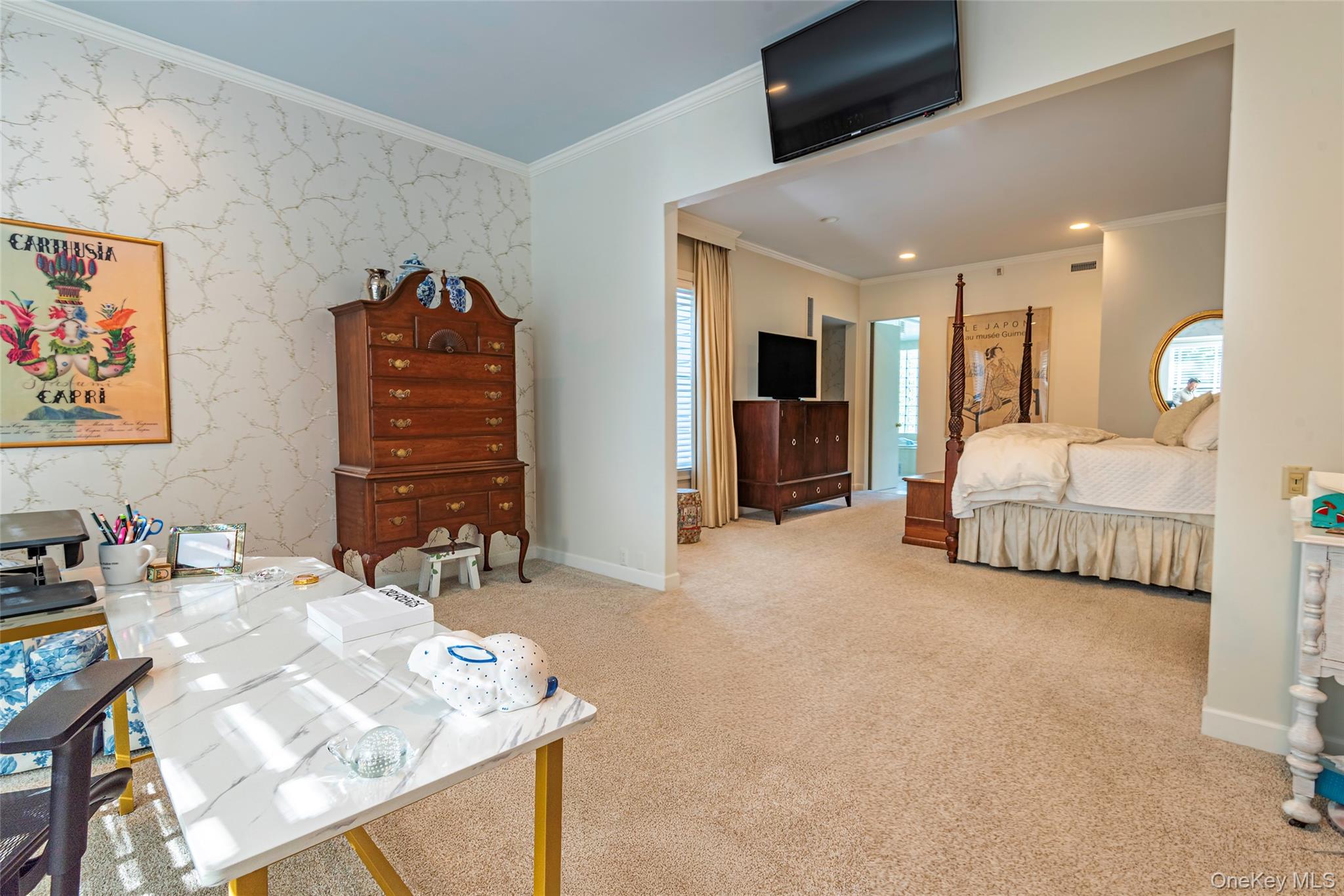 735 Remsens Lane Upper Brookville, NY 11771 - Photo 19 of 44 Bedroom with ornamental molding, wallpapered walls, light colored carpet, and an accent wall