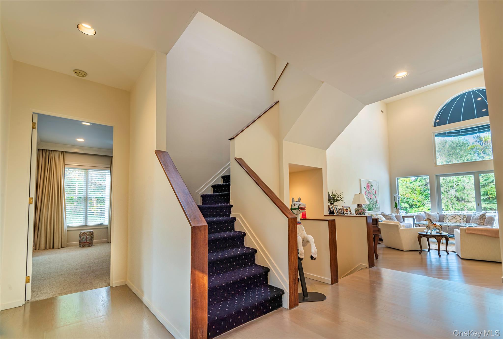 735 Remsens Lane Upper Brookville, NY 11771 - Photo 5 of 44 Stairway with recessed lighting, wood finished floors, and a high ceiling