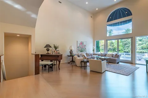 a house with swimming pool in front of it