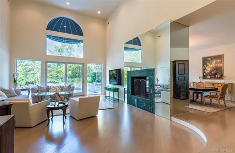 a view of a swimming pool with an outdoor space and seating area