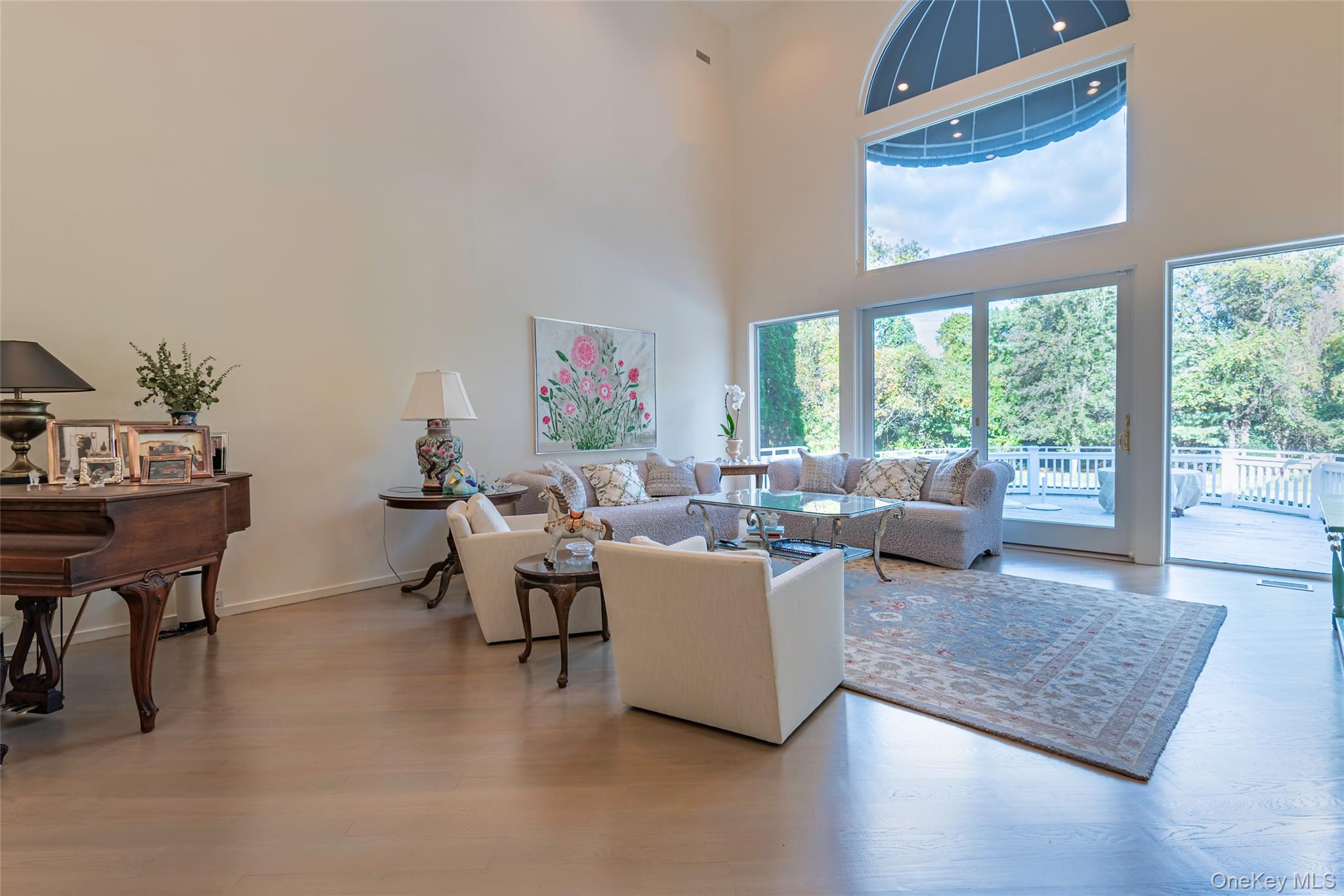 735 Remsens Lane Upper Brookville, NY 11771 - Photo 8 of 44 Living room with light wood-style floors and a high ceiling