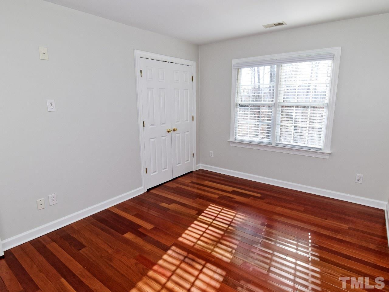 2420 Finley Ridge Lane Raleigh, NC 27615 - Photo 25 of 37 a view of a room with wooden floor and window