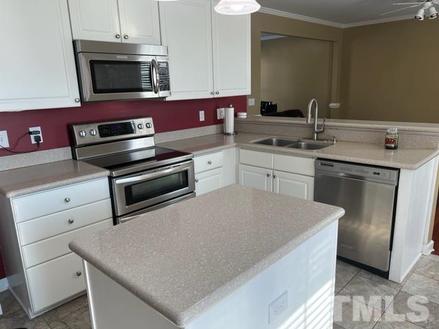 2420 Finley Ridge Lane Raleigh, NC 27615 - Photo 3 of 37 a kitchen with a stove microwave and sink