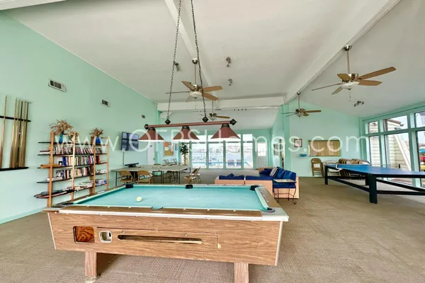 a room with lots of tables and chairs