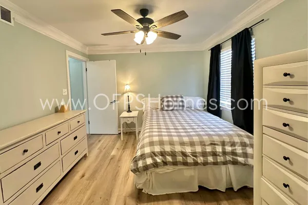 a bedroom with a bed and a dresser