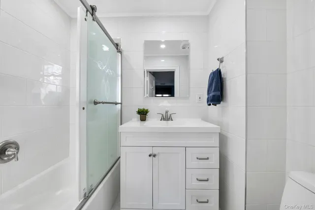 a bathroom with a sink a mirror and a bathtub