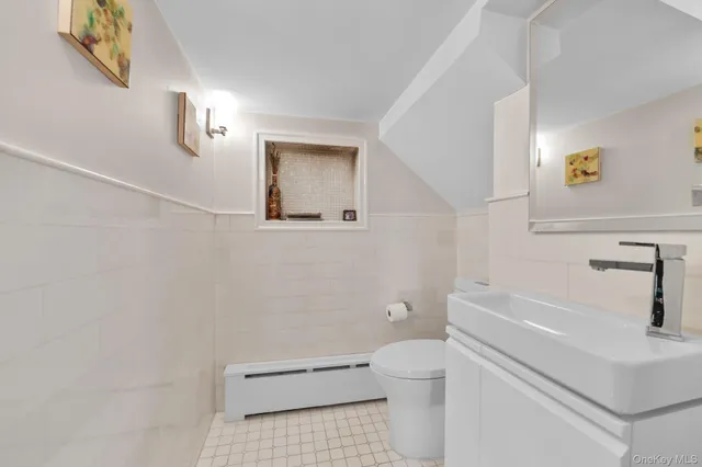 a bathroom with a toilet a sink and bathtub