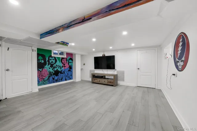 a view of a room with furniture wooden floor and window