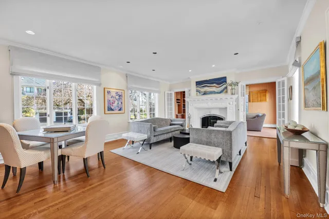 a living room with furniture fireplace and a table