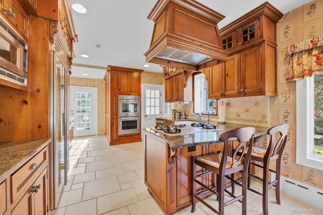 a view of a kitchen with furniture and windows