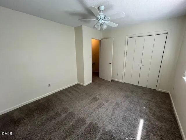 an empty room with fan