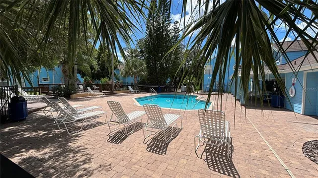 a view of swimming pool with a patio