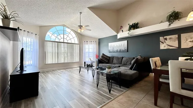 a living room with furniture and a large window