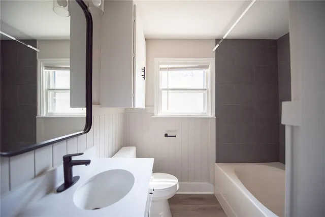a bathroom with a sink toilet and bathtub