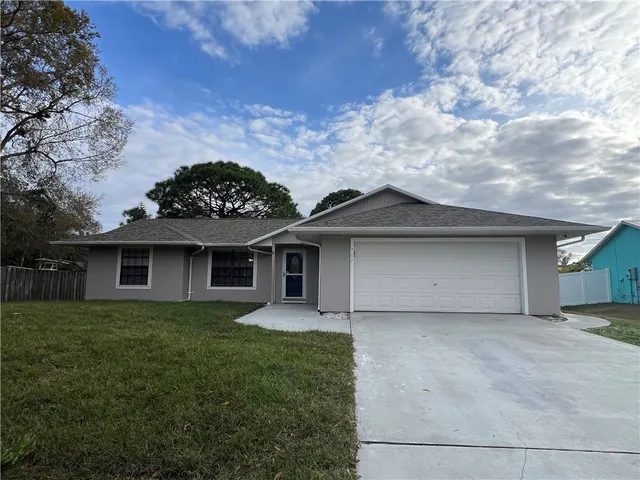 front view of a house with a yard