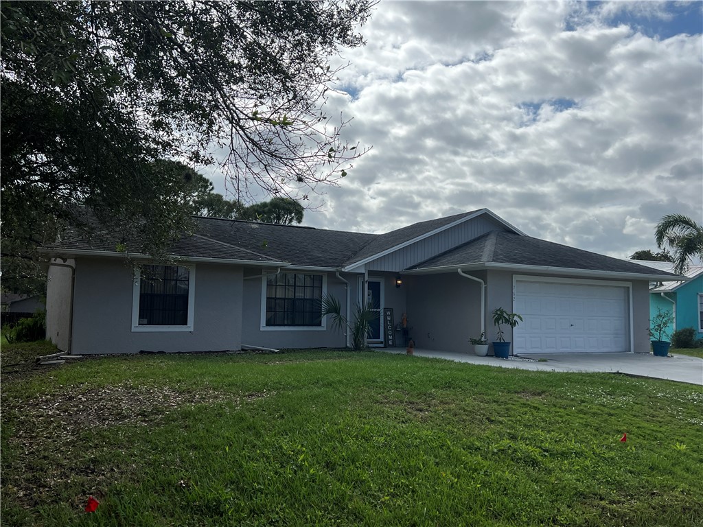 762 Bayfront Terrace Sebastian, FL 32958 - Photo 1 of 11 a front view of house with yard and green space