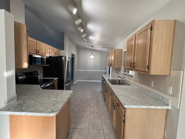 762 Bayfront Terrace Sebastian, FL 32958 - Photo 3 of 11 a kitchen with stainless steel appliances granite countertop a sink stove and refrigerator