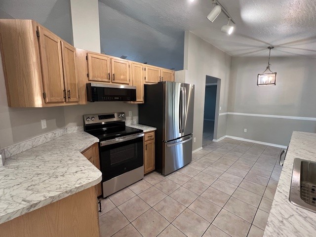 762 Bayfront Terrace Sebastian, FL 32958 - Photo 5 of 11 a kitchen with stainless steel appliances granite countertop a refrigerator a stove a sink and a microwave